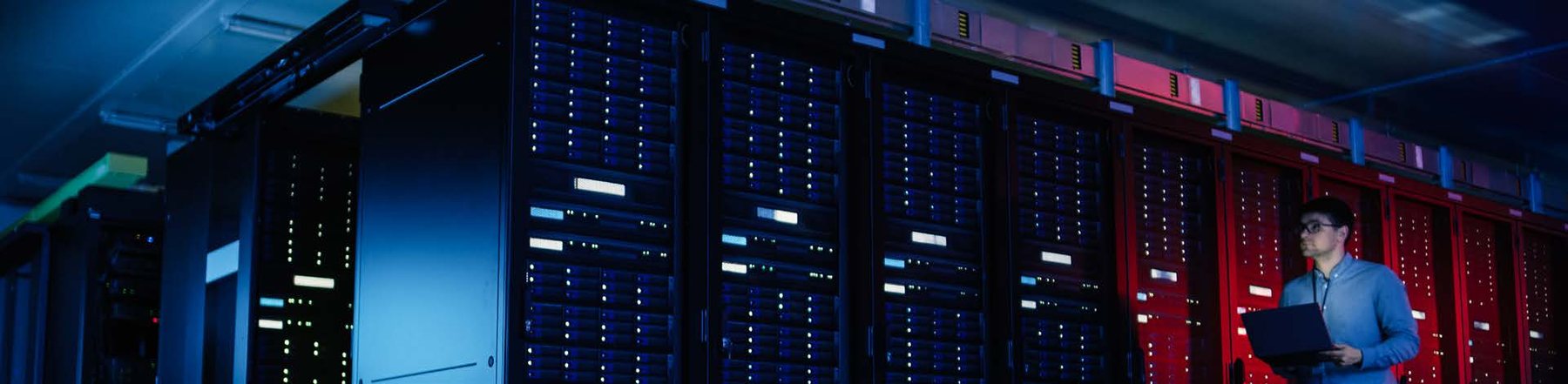 Data centre with rows of illuminated server racks
